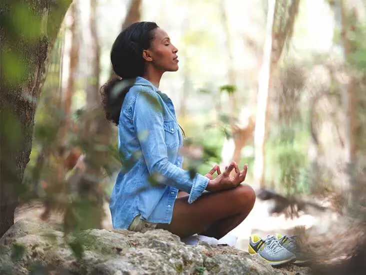 Person practicing box breathing technique in a calm environment